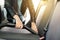 Woman cleaning, vacuuming interior of the car by vacuum cleaner, transport concept