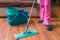 Woman is cleaning wooden floor with mop