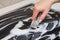 Woman cleans the electronic ceramic hob