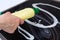 Woman cleans the electronic ceramic hob