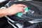 Woman cleans the electronic ceramic hob