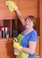 Woman cleans the house