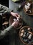 woman cleans porcini mushrooms in a basket top view harvest of forest