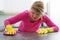 Woman clening a stain on kitchen counter