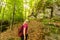 woman cliff in the mountain, woman with backpack on the mountain