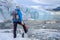 Woman climber standing near Jostedalsbreen glacier.