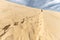 Woman climbing the huge Pyla sand dune