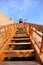 Woman climbing wooden steps at mount hua