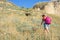 A woman climbs the hill