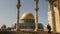 A woman climbs steps towards the dome of the rock, jerusalem