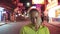 Woman close up look caucasian at Pattaya Walking Street with wearing protective medical mask. Lockdown quarantine