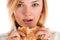 Woman closeup eating a hamburger