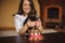 Woman closing eyes of toy terrier birthday cake infront