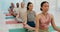 Woman, coach and meditation in yoga class or relax for spiritual wellness, awareness or stress relief. Calm female