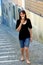 Woman on cobblestone street with ice cream cone