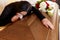 Woman with coffin crying at funeral in church