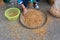 Woman collecting almond nuts in market, thailand, motion blur