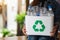 A woman collecting and holding a recyclable garbage plastic bottles in a trash bin