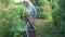 A woman collects water in a watering can.