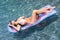 woman on colorful pool float