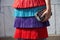 Woman with colorful skirt with fringes before Stella Jean fashion show, Milan Fashion Week street style on