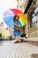 Woman with colorfull umbrella at the city center