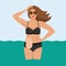 Woman with colostomy bag on sea holiday