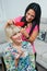 Woman combing friends hair