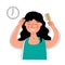 Woman combing her hair with a comb. Morning routine.