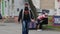 A woman comes to a street table where Easter sweets are sold and hugs friendly