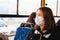 Woman commutes in a protective face mask.