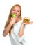 Woman comparing burger sandwich in hand and green apple