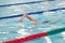 Woman competes in freestyle swimming in a swimming pool