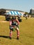 Woman competing in Weight of height strength test at Scottish Highland games getting ready to throw weight over high bar Tulsa Okl