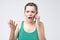 Woman complaining while talking on smartphone, confused and puzzled expression