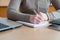 A woman conducts accounting calculations in the office