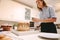 Woman confectioner in kitchen