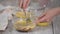 Woman confectioner prepare cream for chocolate mousse cake.