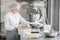 Woman confectioner working at the bakery manufacturing