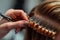 A woman confidently cuts her hair with a pair of scissors, demonstrating a DIY haircutting technique, A close-up image of a