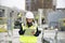 Woman construction site engineer architect worker with hard hat writes notes