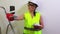 Woman construction worker taking selfies on smartphone