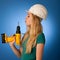 Woman with constructor helmet and tools happy to do tough work.