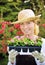 Woman with container-grown plants