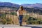 Woman contemplating the mountainous landscape of a viewpoint in the mountain of Grazalema, Cadiz.