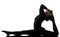 Woman contortionist exercising gymnastic yoga silhouette