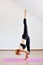 Woman contortionist practicing gymnastic yoga