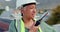 Woman, contractor and technician talking with radio transmitter as manager on construction site. Engineering, walkie