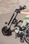 A woman controls a wheelchair using a special manual device. Close up an electric handbike.