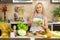 Woman coocking salad at the kitchen table